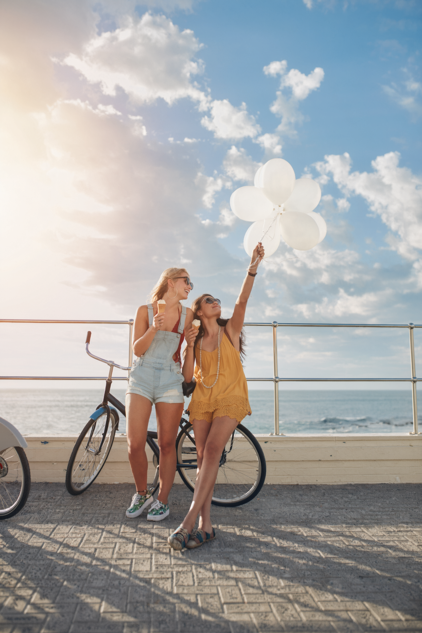 girls on bikes at the beach